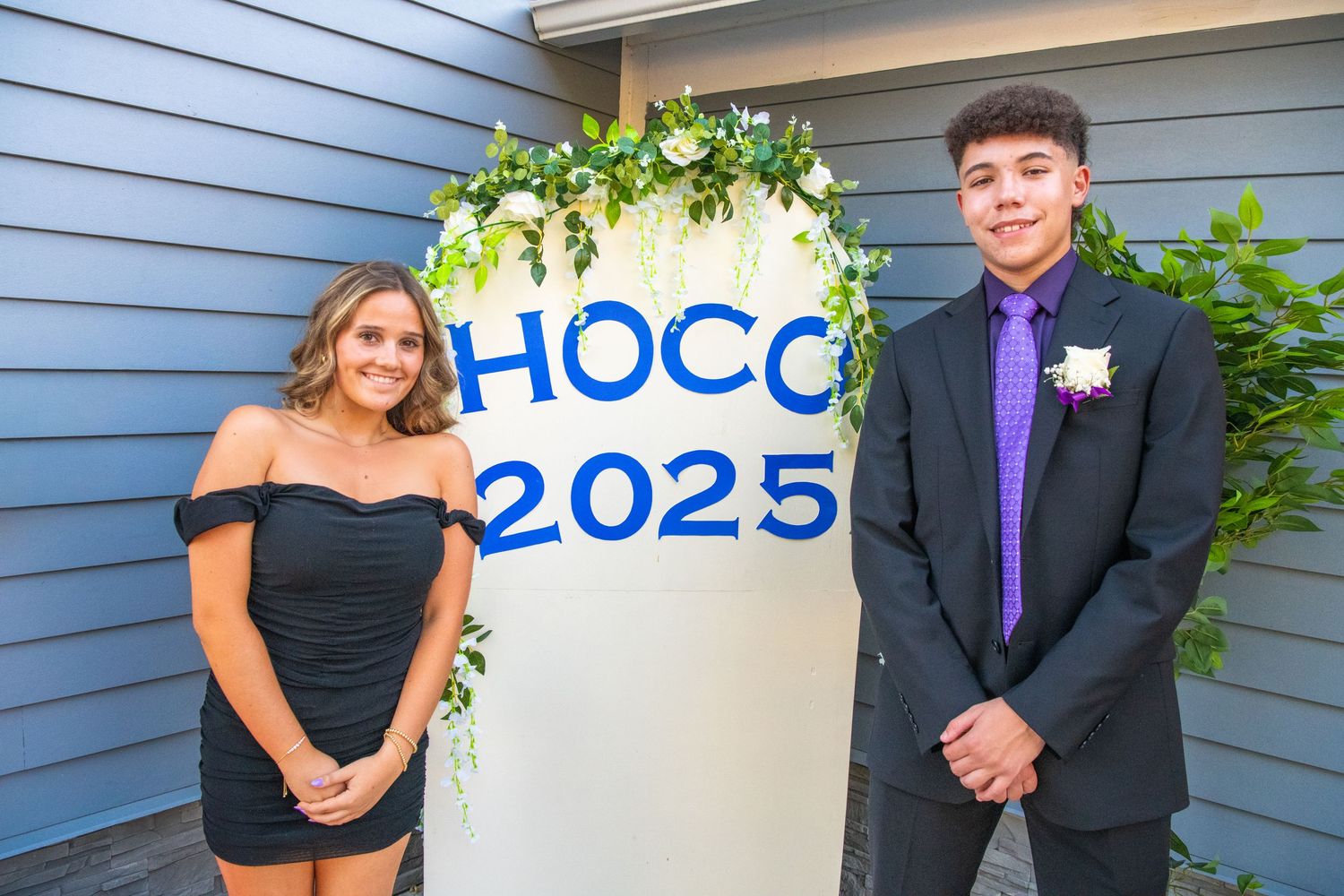A series of five formal event photos taken against a blue house siding with green foliage in the background.