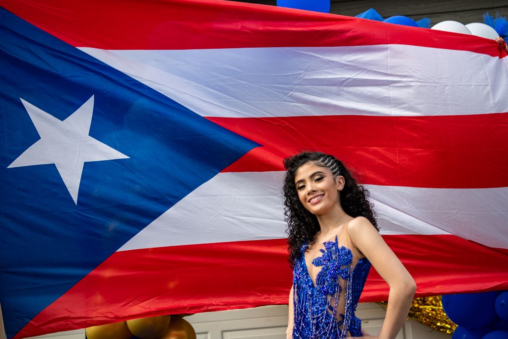 Puerto Rican flag themed decorations and blue formal attire for a special celebration.