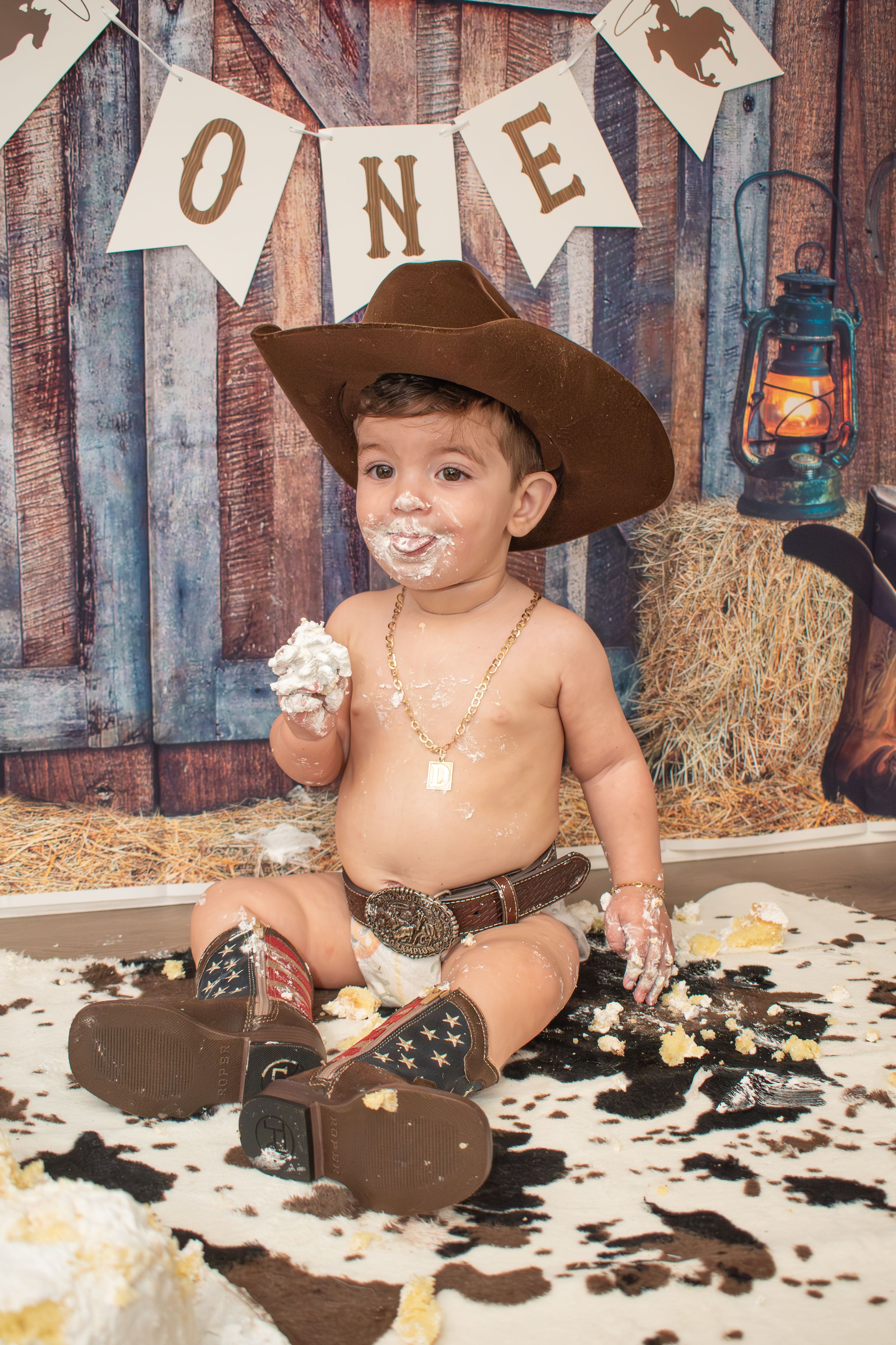 At home baby photoshoot, 1st birthday, cake smash cowboy wild west boy theme near Randolph, Massachusetts