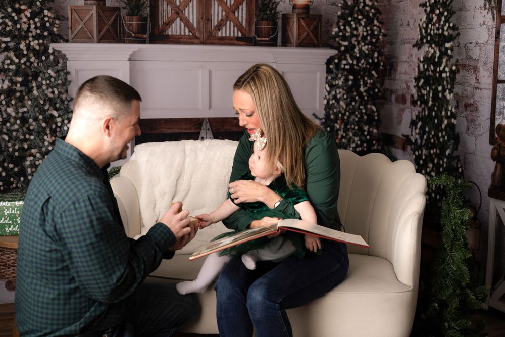 Lifestyle family photography session with natural interactions on white furniture.