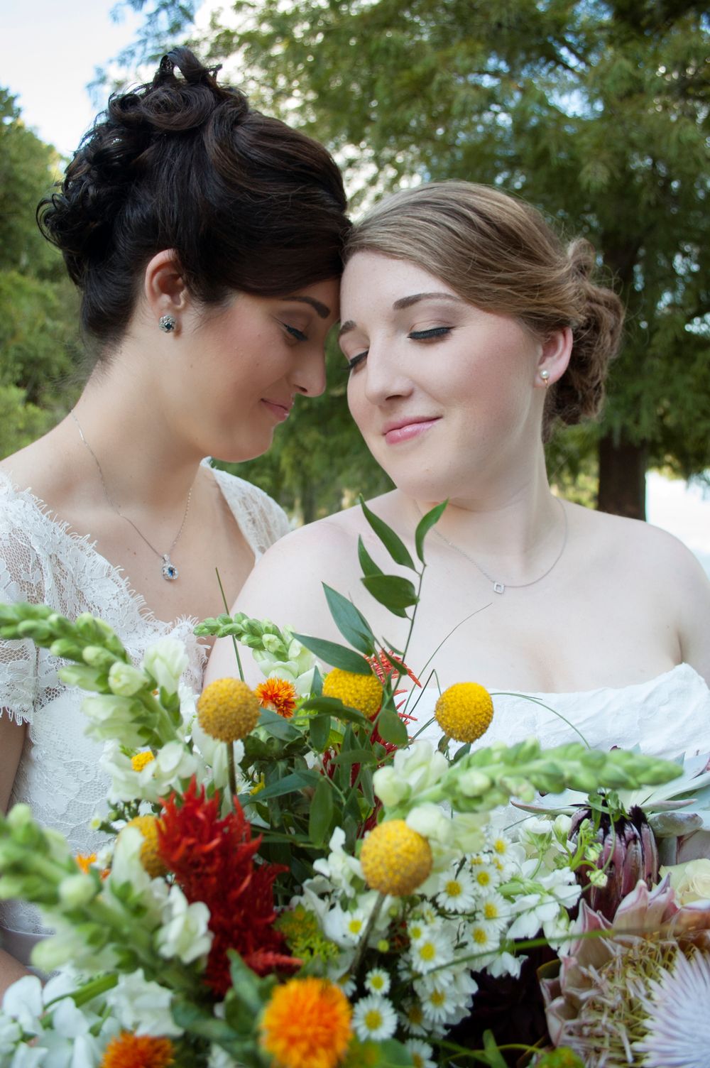 Same sex lesbian brides wedding portrait session at Baughmen Center Gainesville Florida. Natural lighting soft and elegant