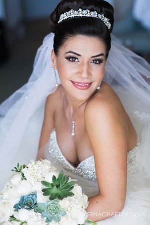 Elegant bridal portrait with crystal tiara, white veil and succulent bouquet.