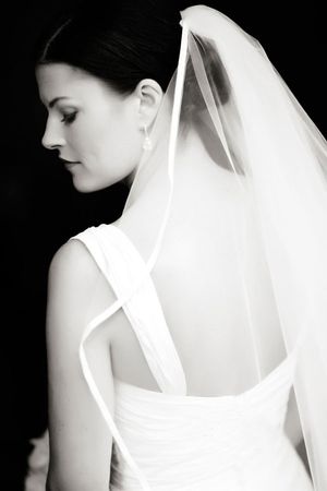 Classic black and white bridal portrait showing elegant veil and dress details.