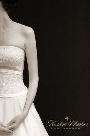 Black and white close-up of strapless lace wedding dress bodice.
