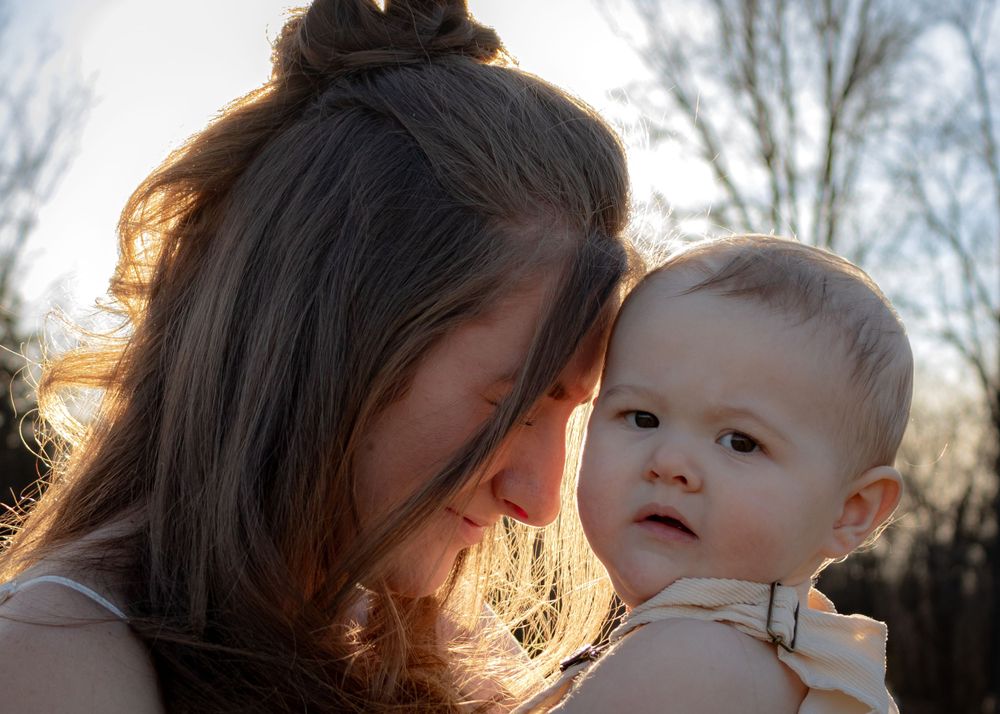 Mom with baby touching foreheads