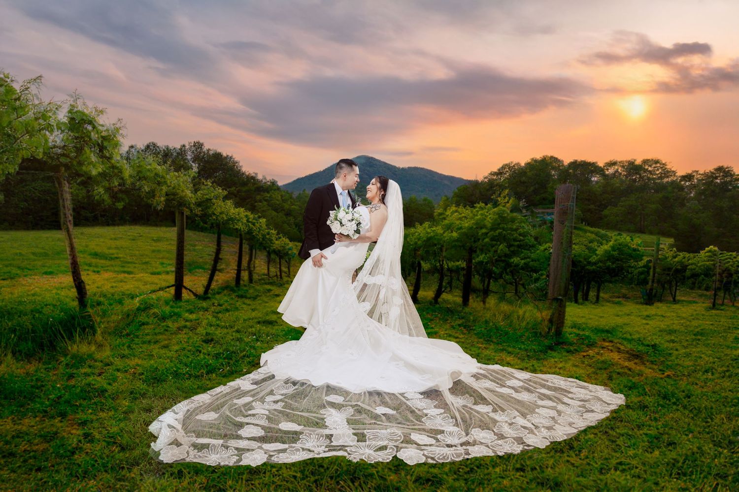 A romantic moment captured on a front porch with white columns and stone accents.