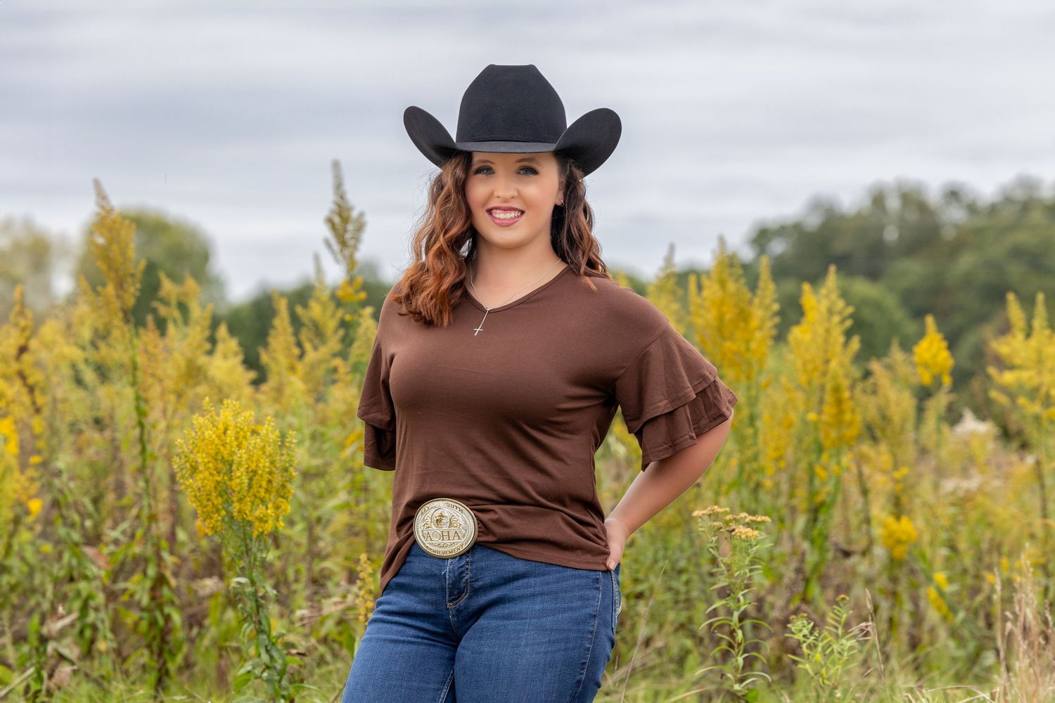 Girl in brown shirt with cowboy hat
