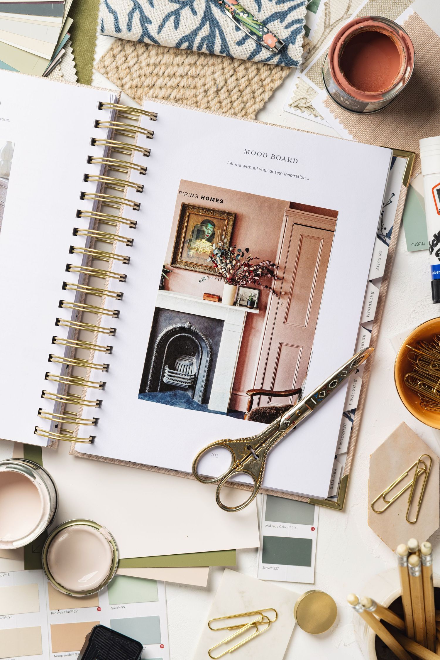 Interior design mood board flat-lay with notebook, paint swatches, scissors and coffee, branding product photography
