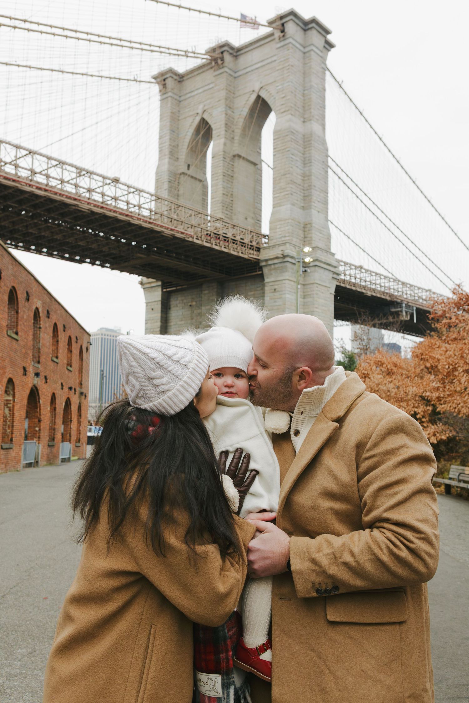 NYC family photographer Paula Brearley capturing a joyful family portrait in a natural, candid moment in New York City.