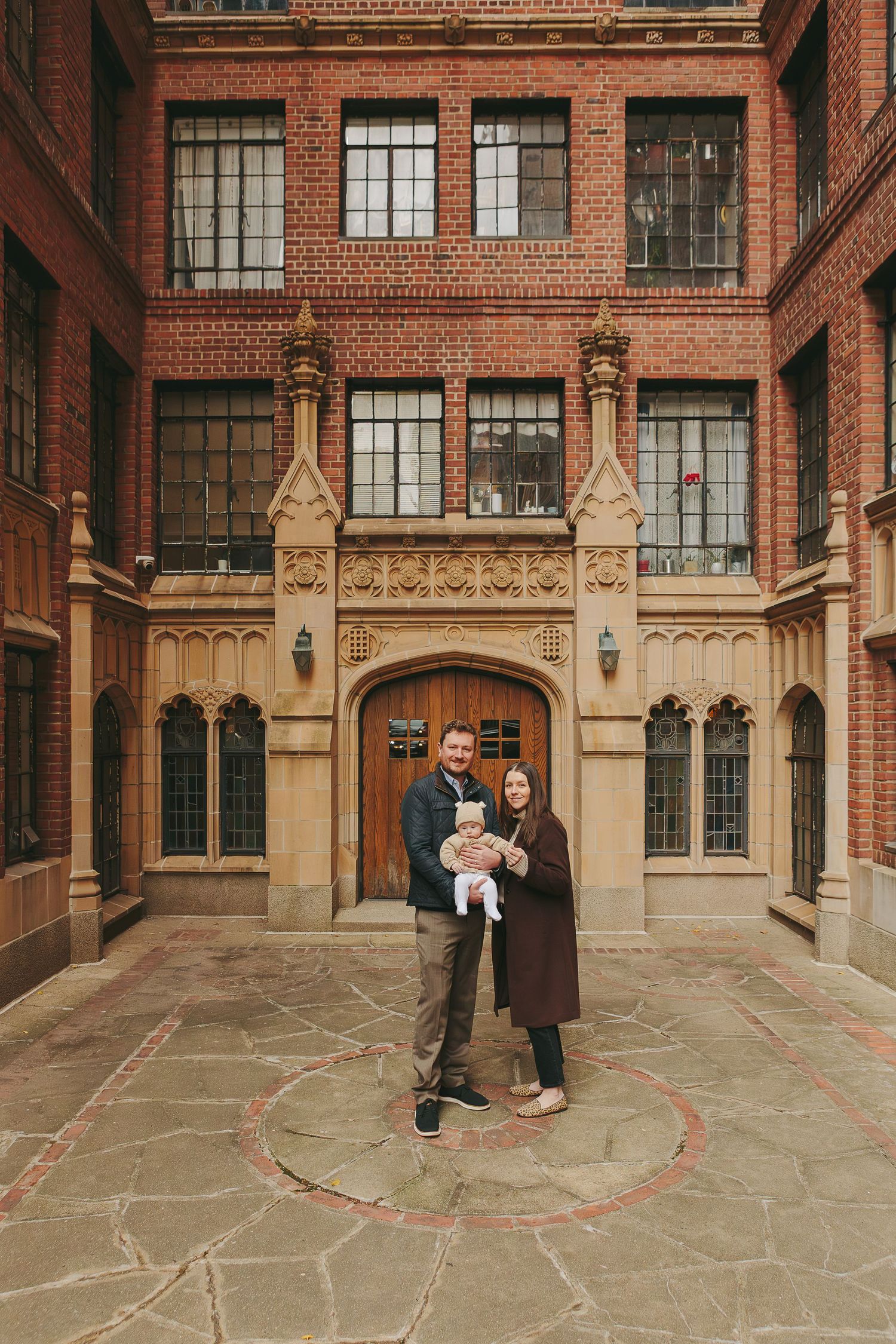Paula Brearley captures a playful family photography moment with siblings and parents during a NYC session
