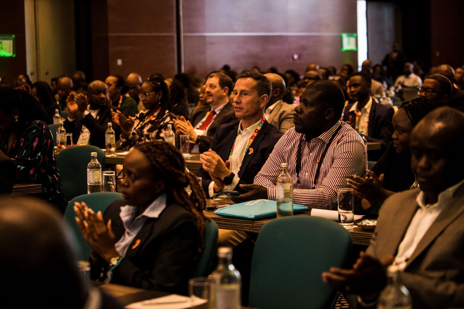 corporate event photography services of conference audience seated in rows during a professional business presentation in Nairobi Kenya