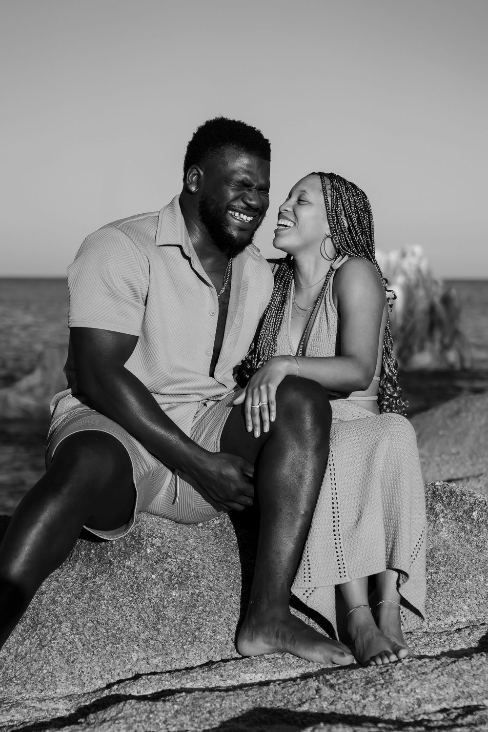 Couple embracing under sunset sky in Los Cabos