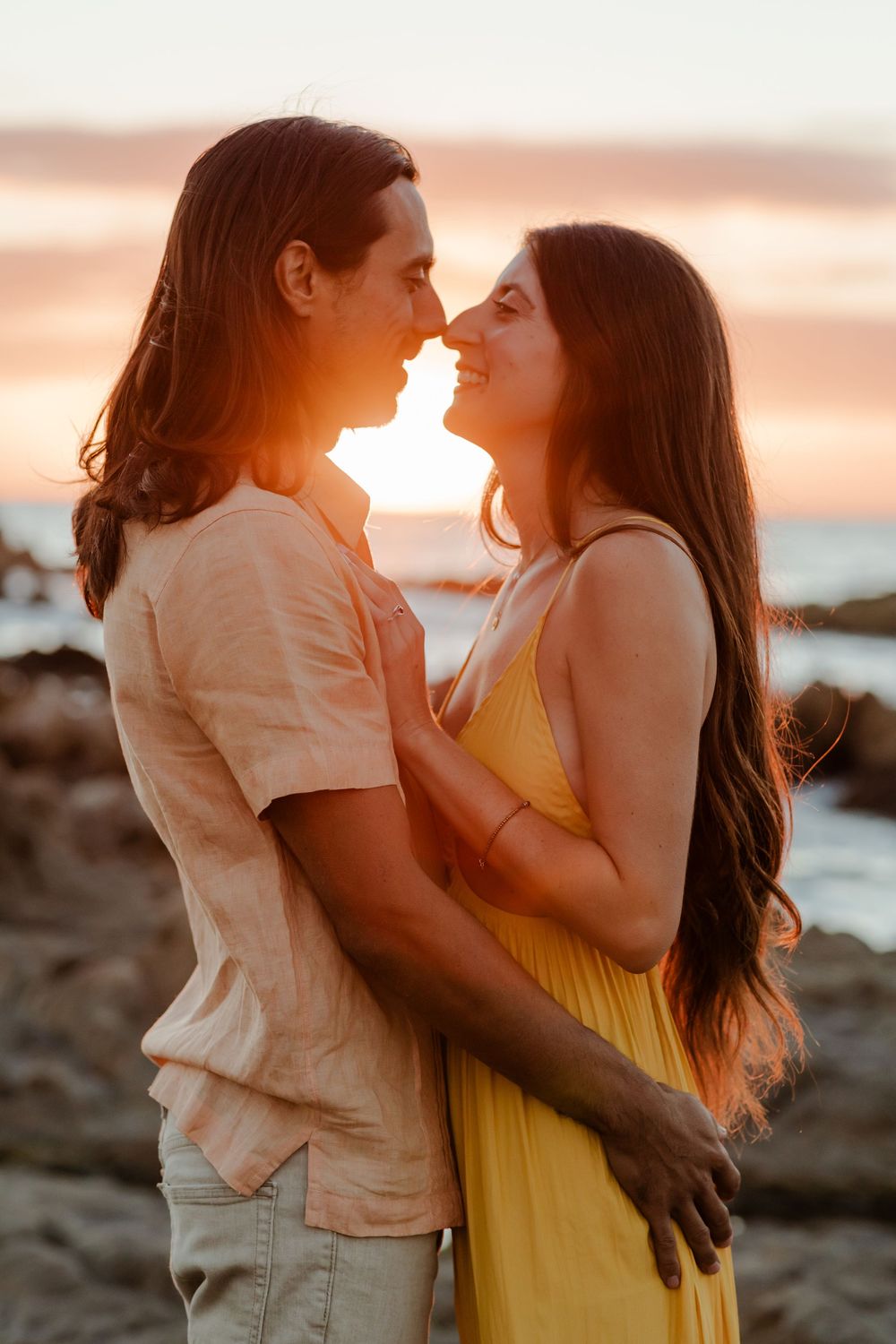 Wedding couple embracing during golden hour in Los Cabos