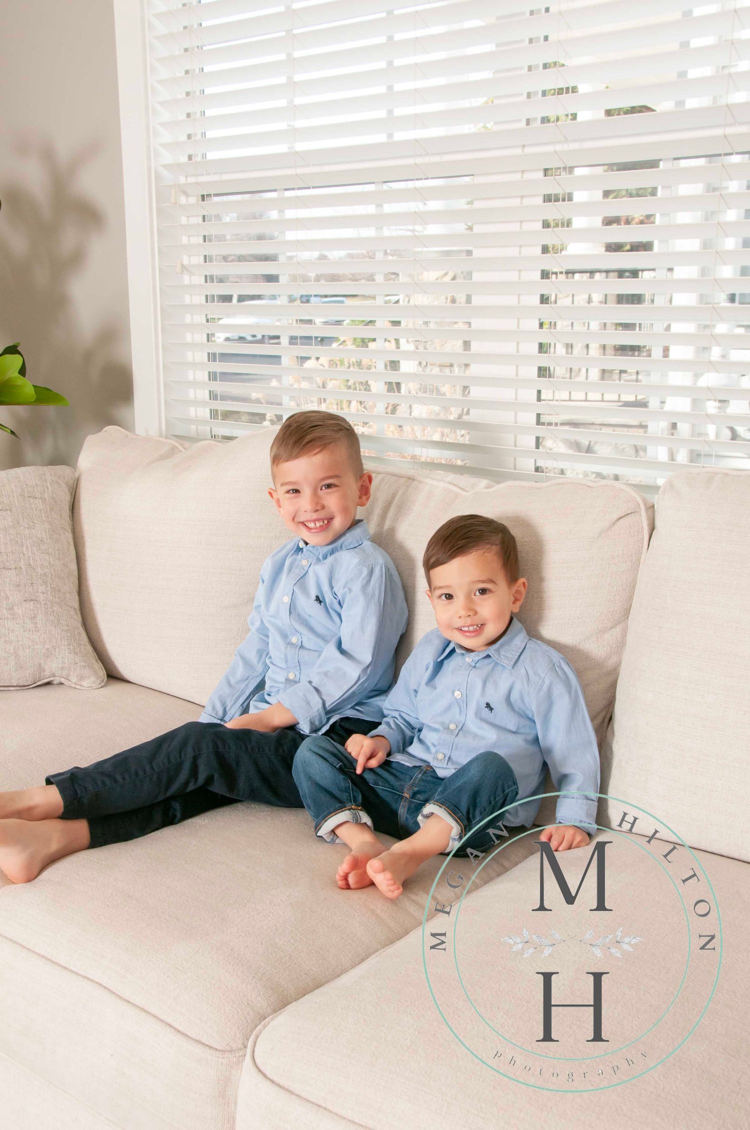 Two boys sitting together on the couch