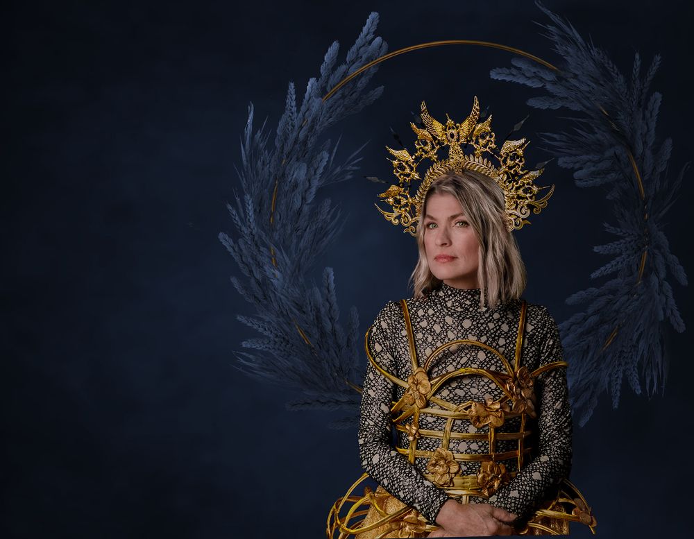 Couture Dress with woman in Gold Cage dress
