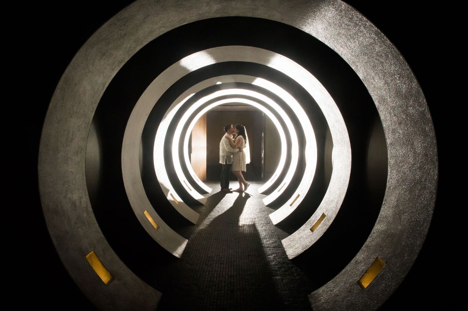 Abstract circular tunnel with concentric white light rings creating a hypnotic perspective.