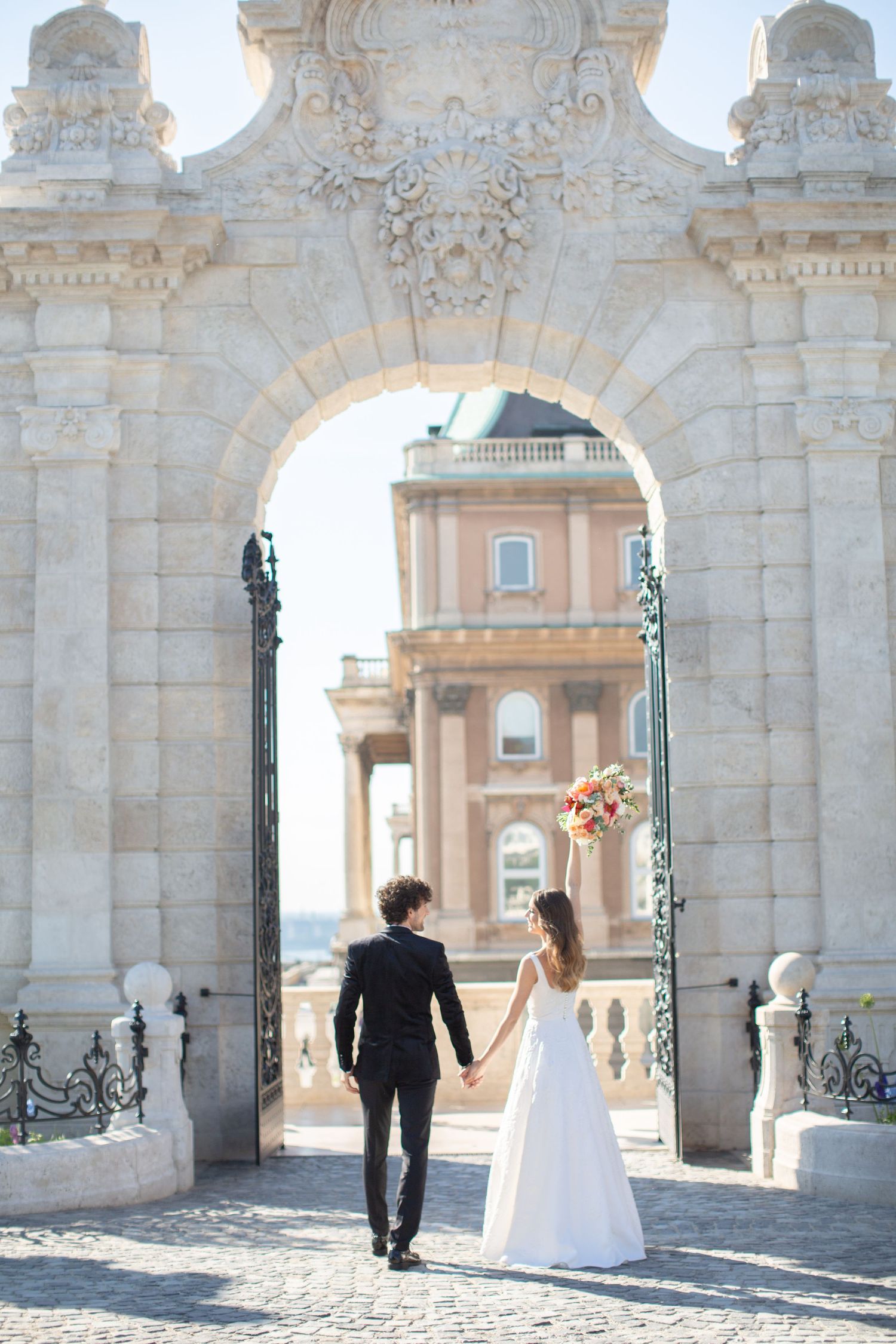 bride-and-groom-with-budapest-city-view-at-fishermans-bastion-destination-wedding-photo.jpg