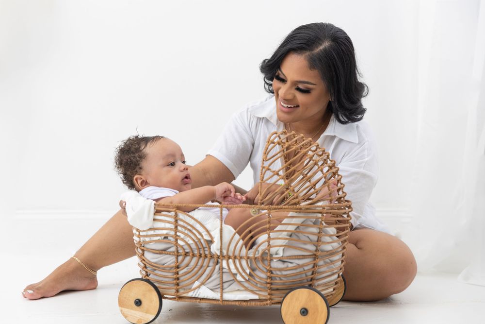 A heartwarming scene with a decorative woven wagon and white studio backdrop.