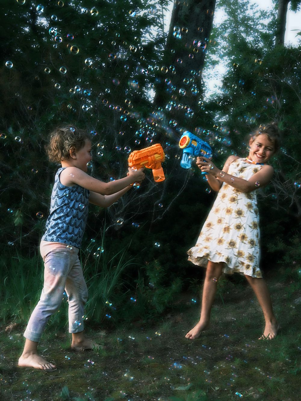 brother and sister playing with bubbles