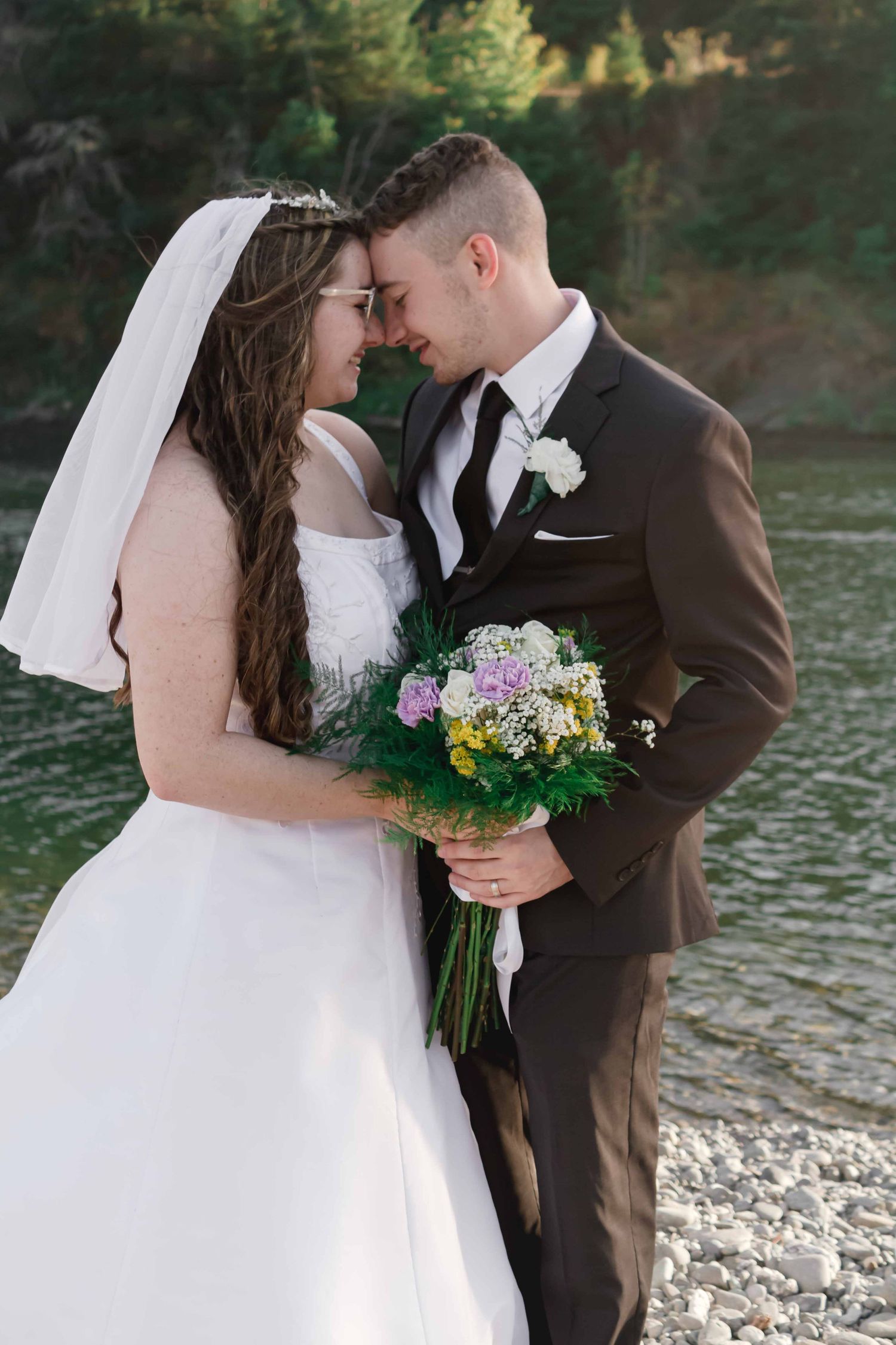 Bride and Groom along the beautiful Rogue River in Gold Beach, Oregon
