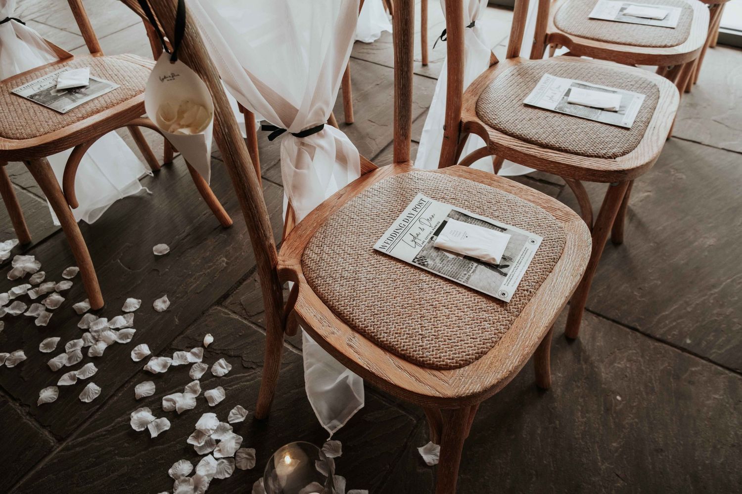 Chair with booklet about the wedding placed on top