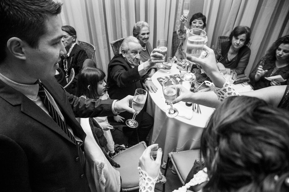 A group plays cards around a table at what appears to be a social gathering.