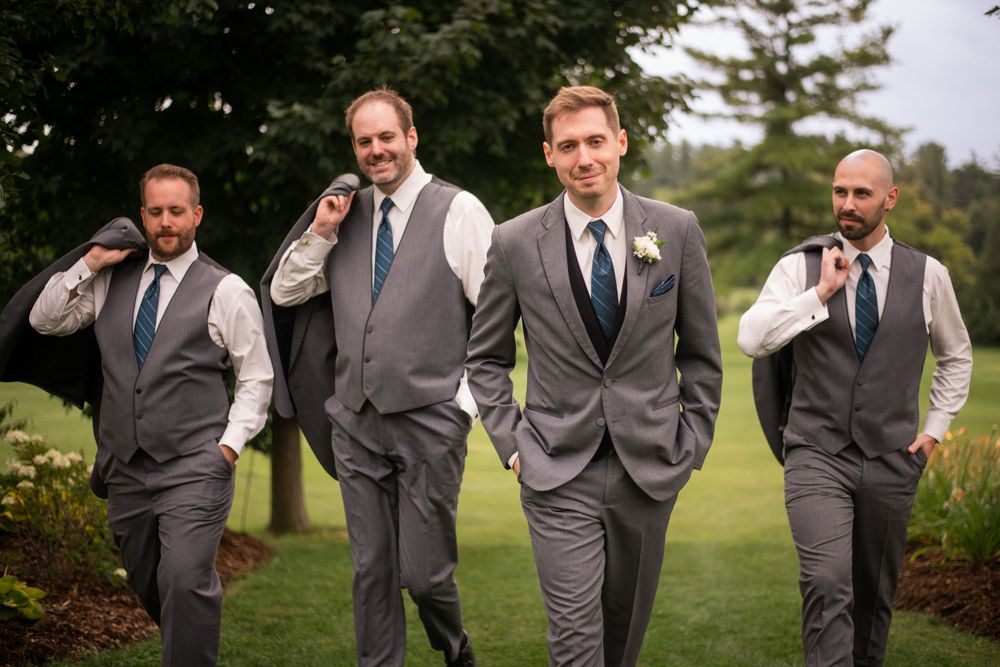 Groom and groomsmen wedding party casual walking shot at Stratford Country Club