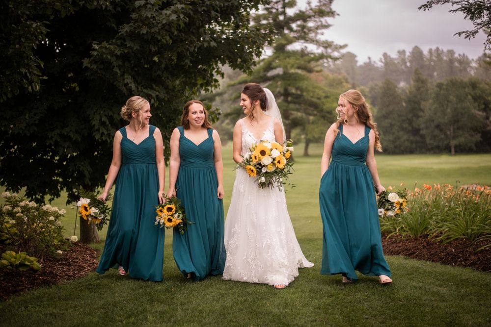 Bride and bridesmaids wedding party candid casual walking shot at Stratford Country Club