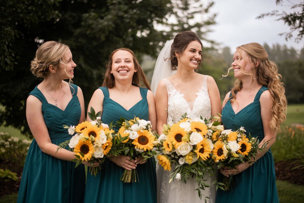 Bride and bridesmaids wedding party close up candid laughing at Stratford Country Club