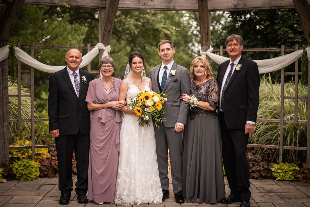 Bride and groom with parents at Stratford Country Club