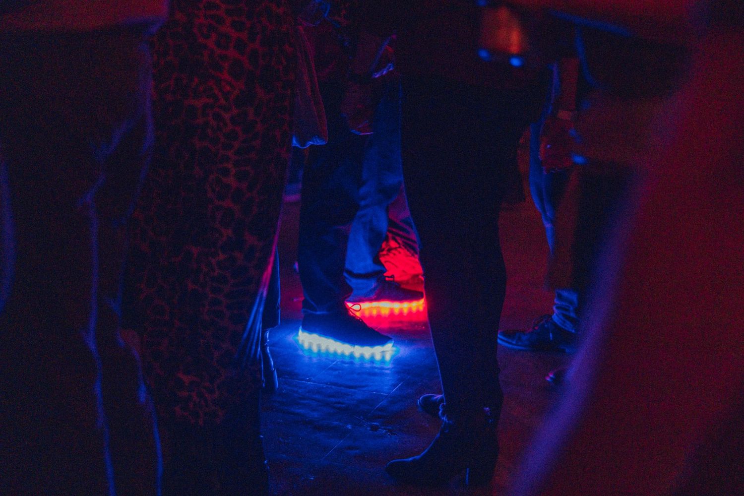 an audience member wears light-up shoes