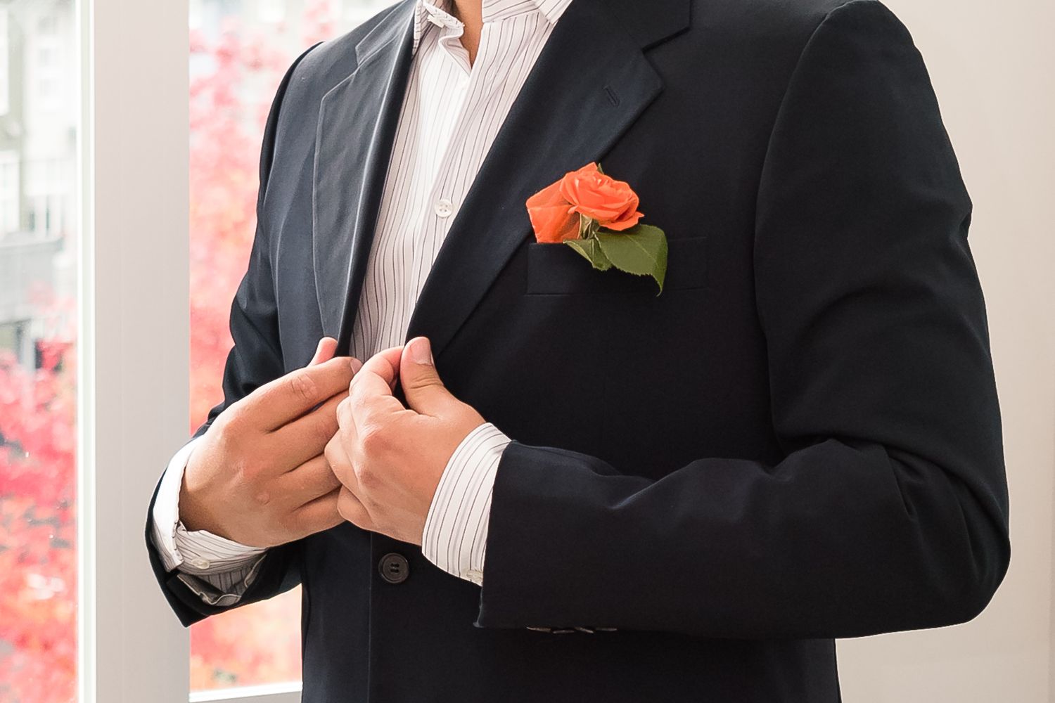 A groom detail image featuring his boutonniere. Photo taken in Maple Ridge by Kari Mills Photography.