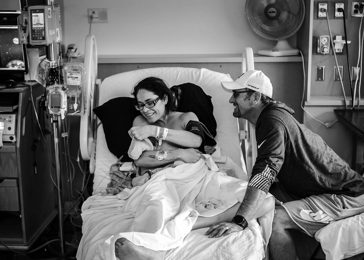 Mother and father meeting their newborn son.