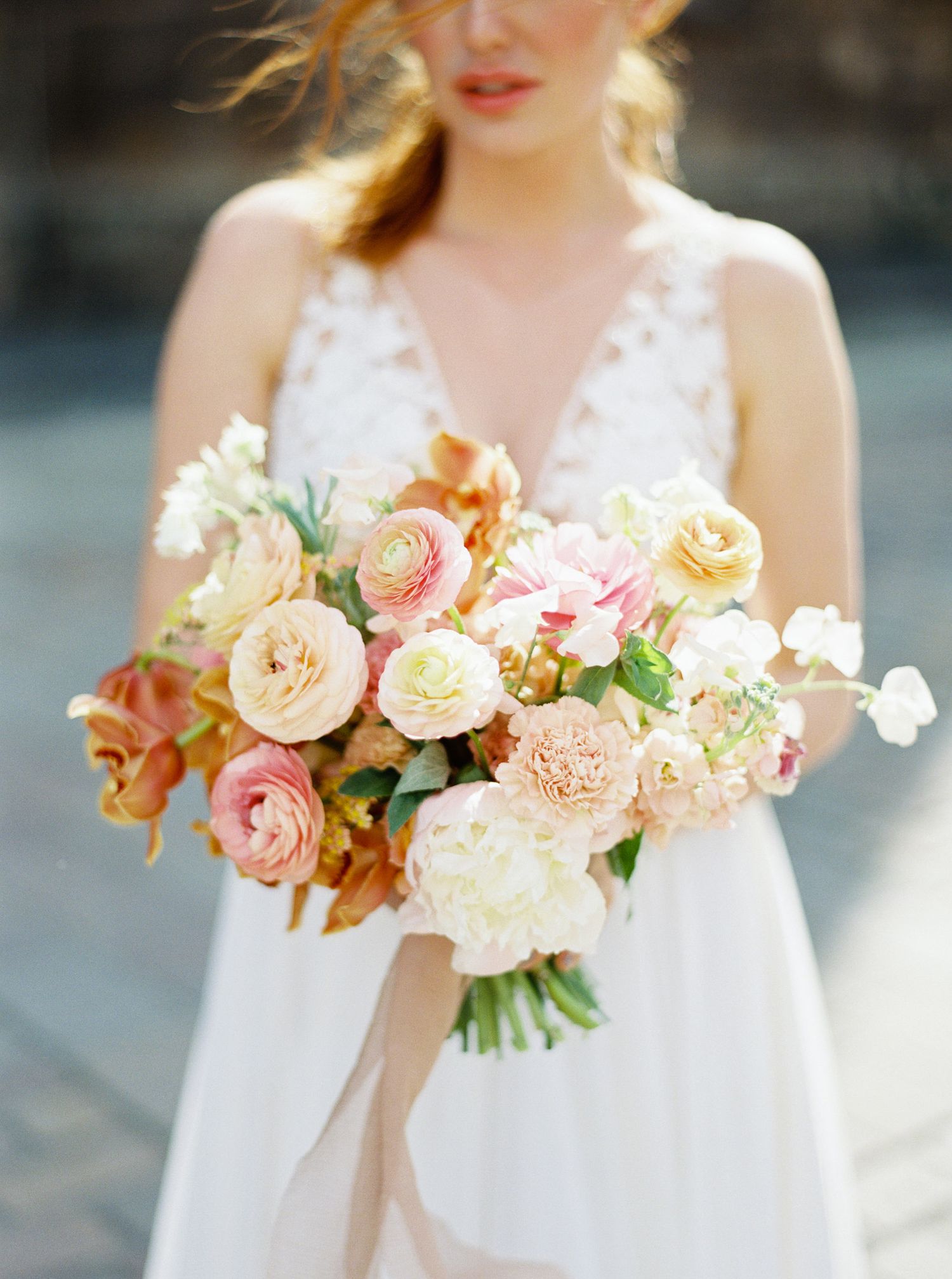 Prague bride holding a lovely flower arrangement.