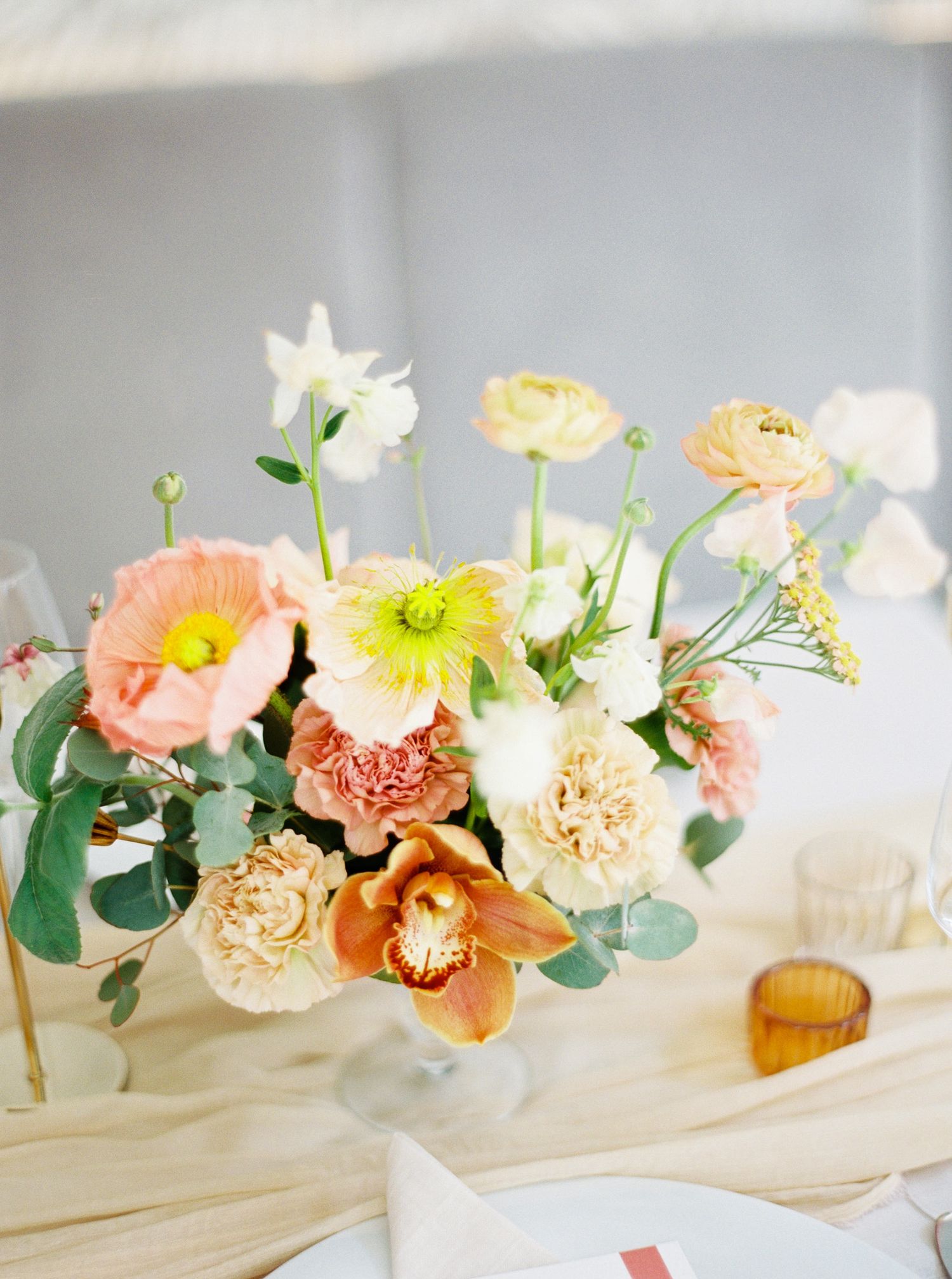 Beautiful flowers in a vase, part of a Prague wedding reception decor.