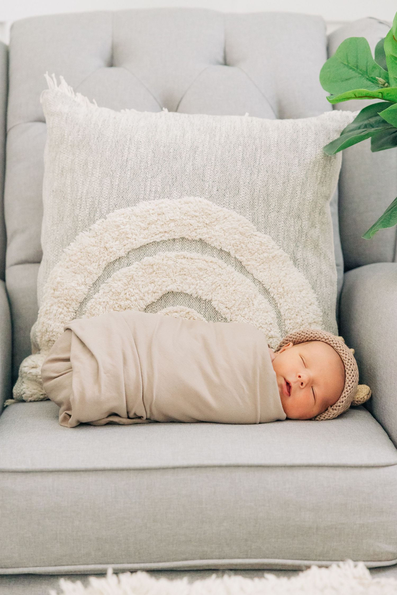 Newborn wrapped in a swaddle in his nursery photographed by Sarasota Newborn Photographer Samantha Brown Artistry.
