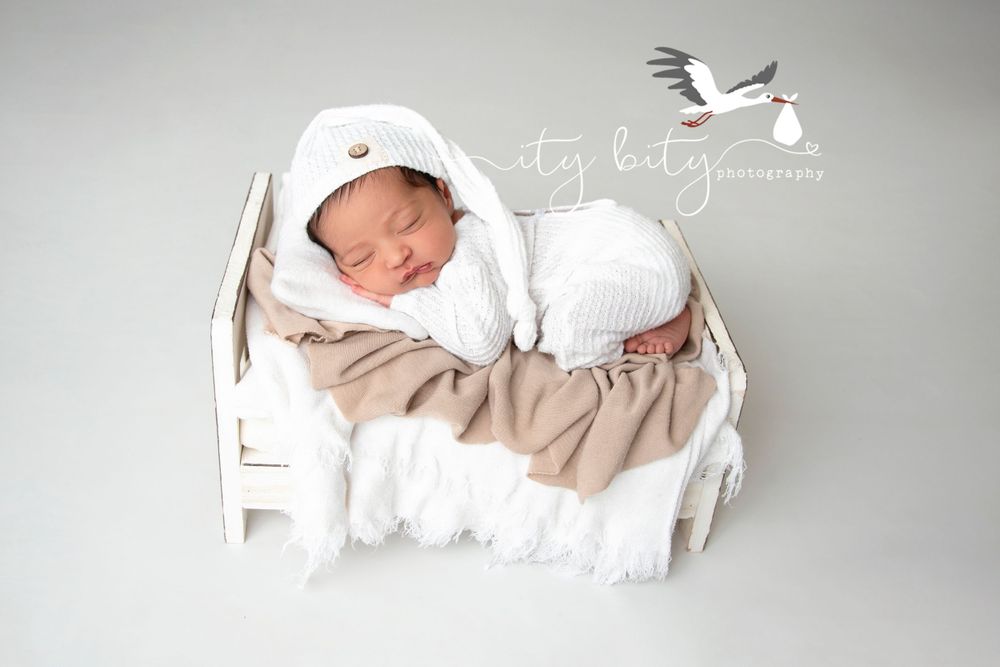 Baby Ayush Copley Newborn & Family Photographer in little bed