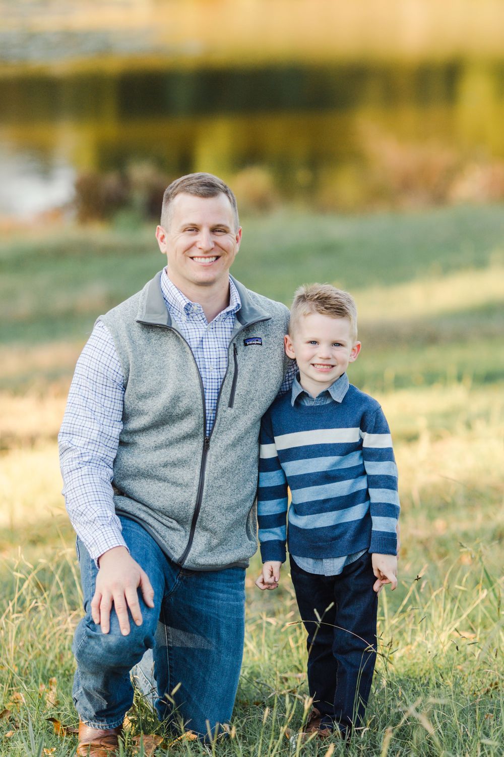 Parent and child pose together outdoors wearing coordinating casual outfits.