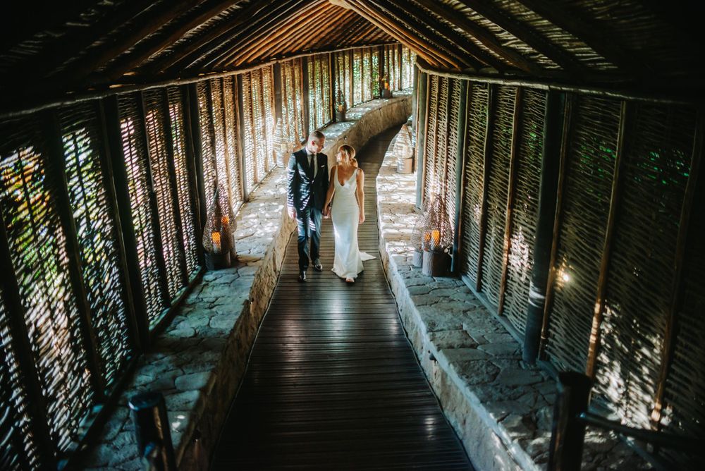 Sugar Beach Viceroy- destination wedding couples walks along the spa entrance