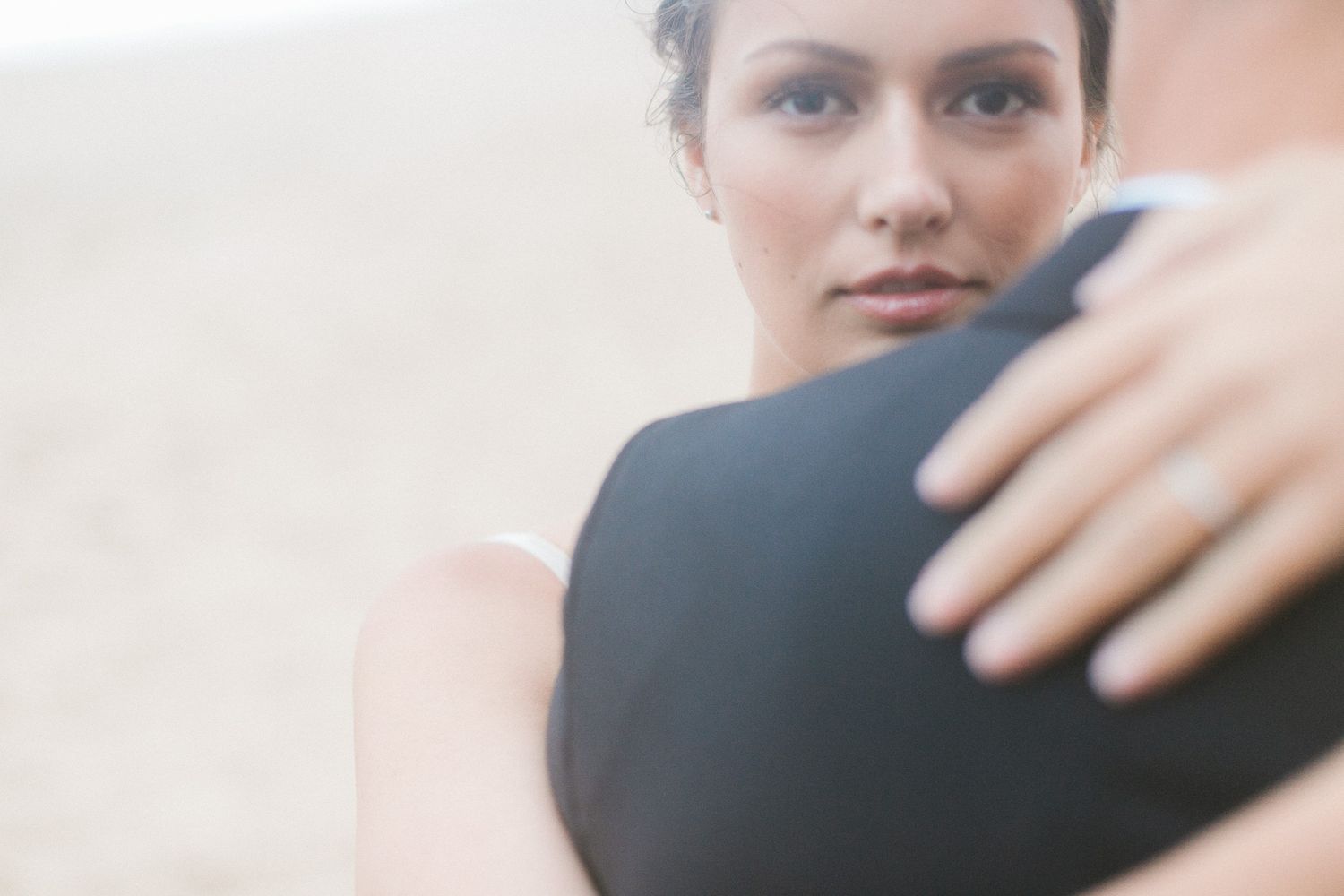 Close-up portrait shot showing soft, dreamy aesthetics and dramatic lighting.
