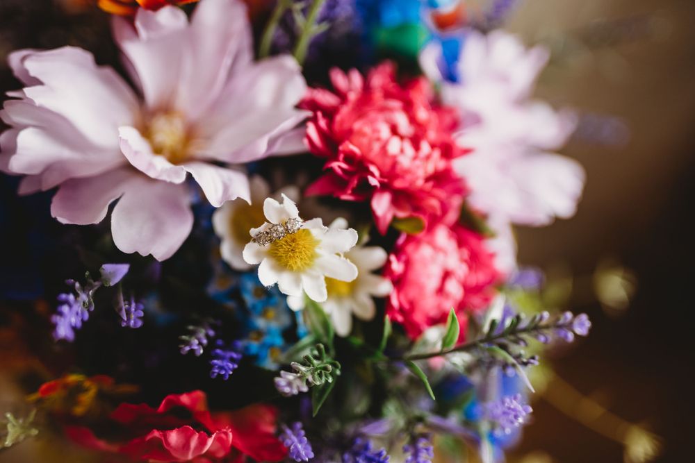 Colorful wedding bouquet with pink and white flowers in macro detail.