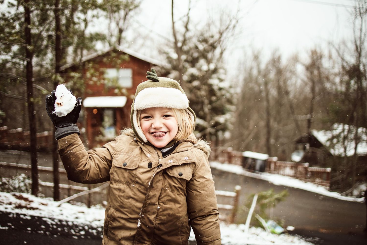 Lakeland Family Photography- Little boy throwing snowball