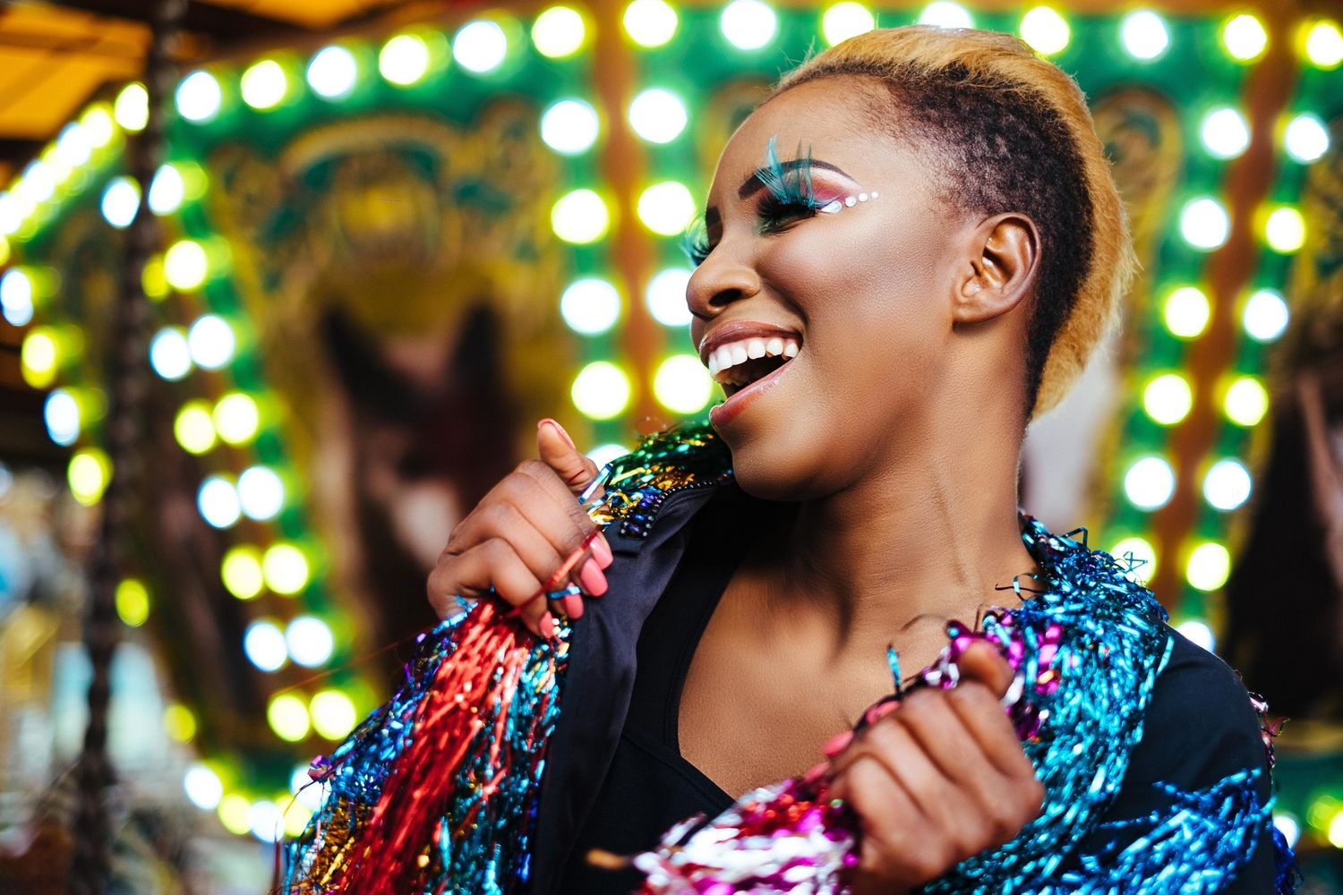 Festive party scene with colorful lights and sparkly decorations.