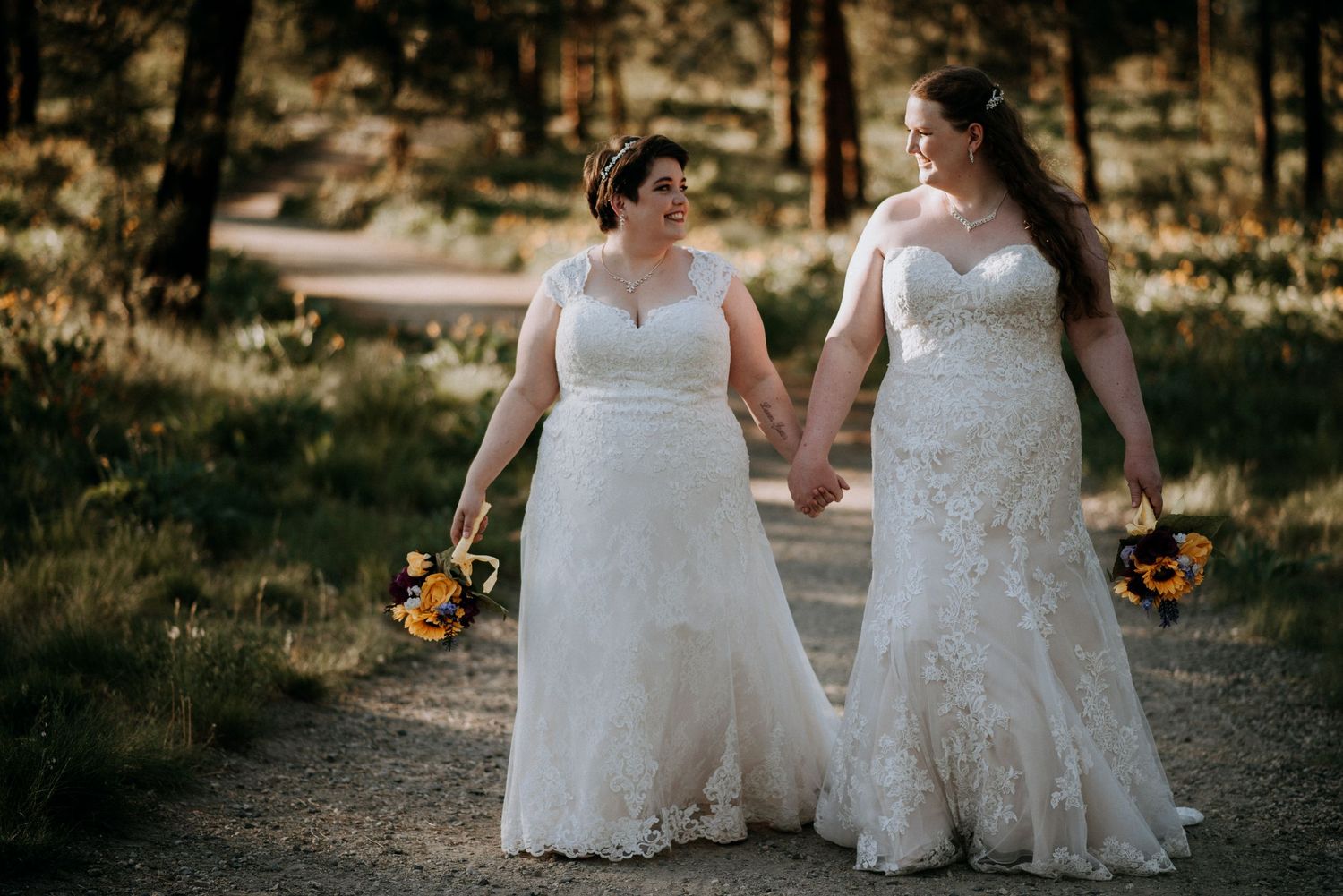 Brides walking together in Kelowna during summer wedding