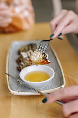 food dipping into butter and dripping