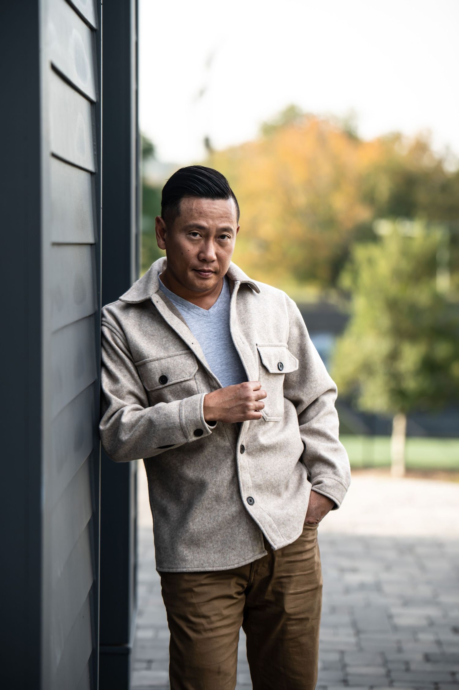 Casual lifestyle portraits against modern architecture with natural window light.