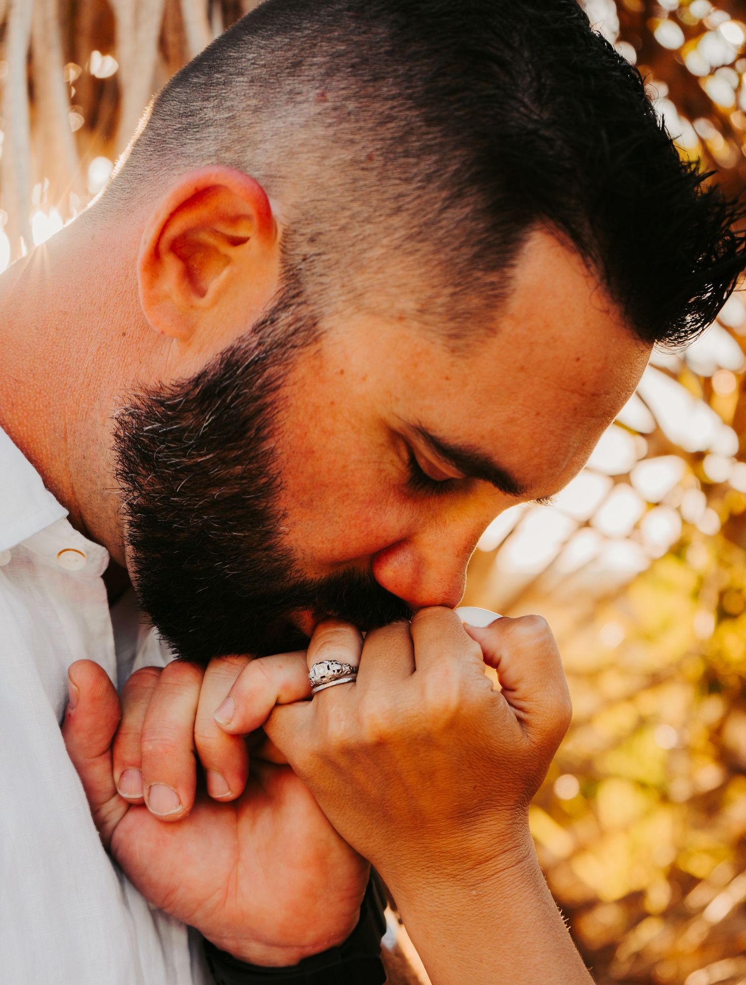 Outdoor Engagement Session Ft. Desoto, St. Pete, FL; Man kissing woman's hand close up of ring
