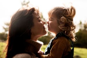 Mother and daughter portrait, backlit by the sun