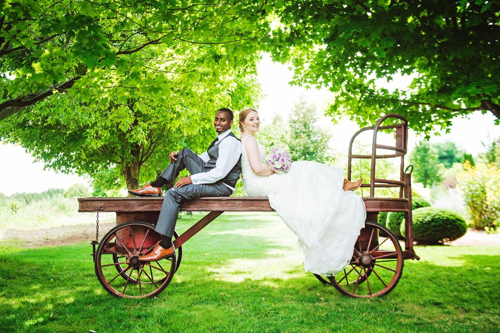Wedding photography series featuring vintage bicycle props in a garden setting at Cranberry Creek Gardens.