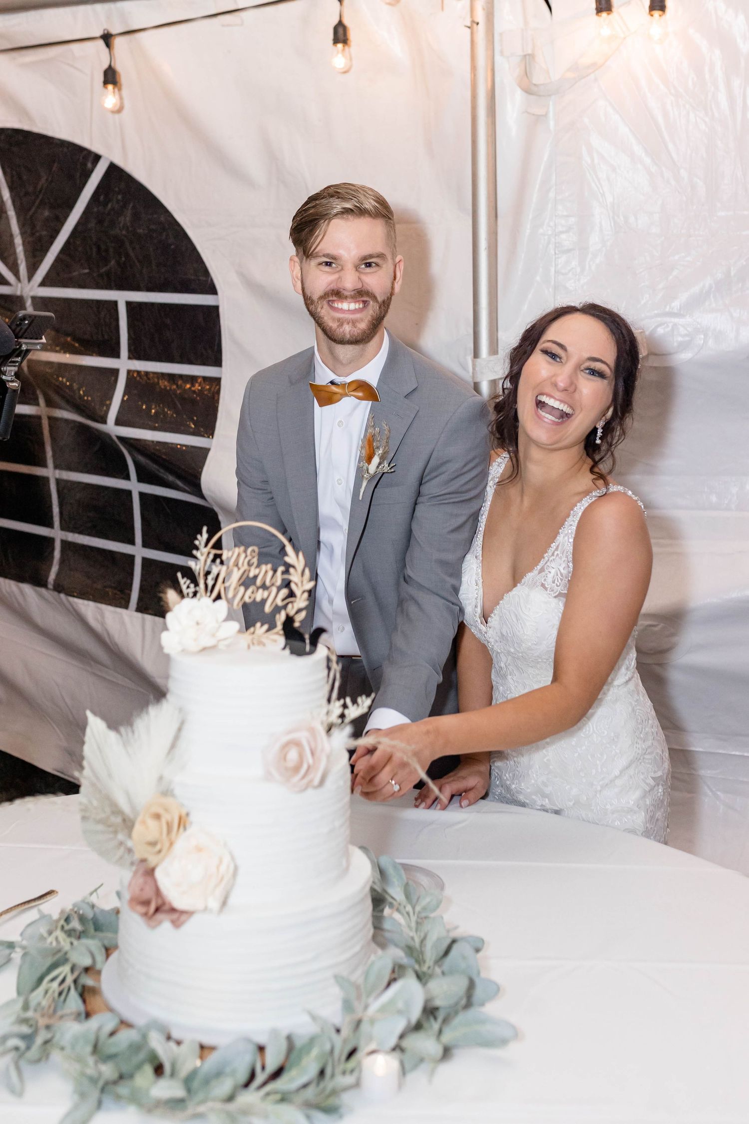 bride and groom cut the cake